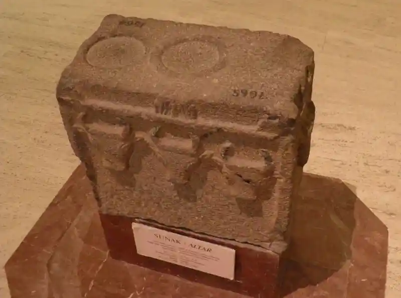 Sunak or Altar, block of stone with three bull's head design and some inscription